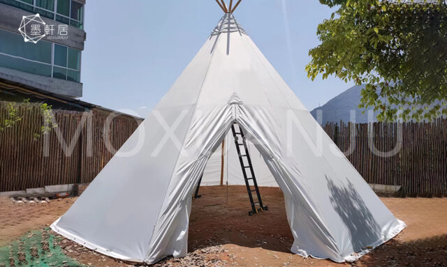 three white teepee tents