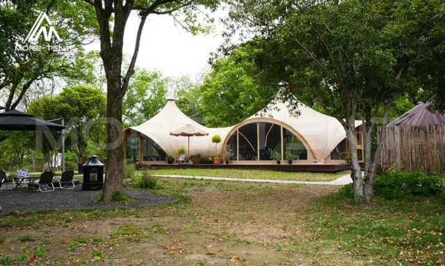 Canvas Safari Tent used as a multifunctional outdoor reception area