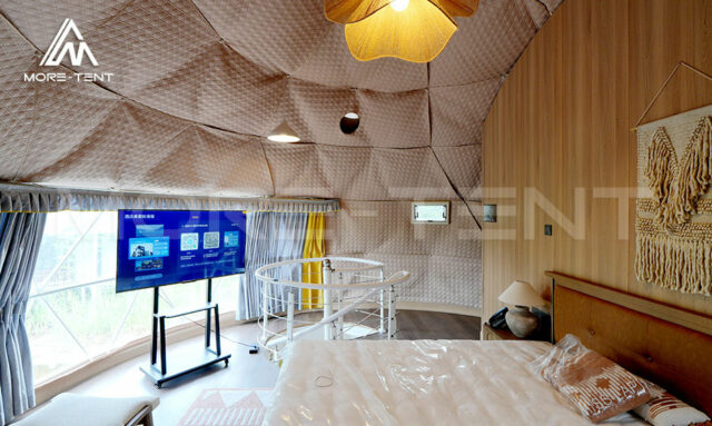 Luxury glamping tent interior with living room and kitchen layout