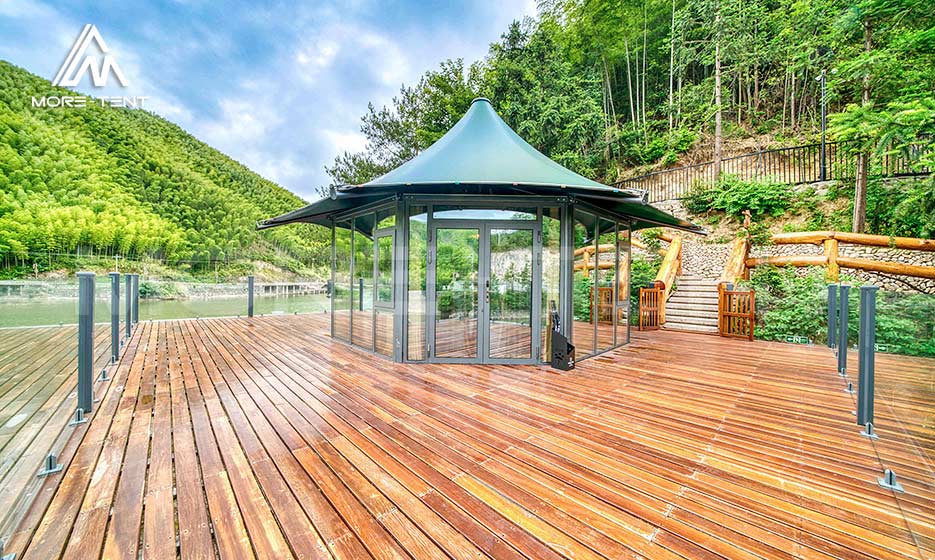Panoramic glamping tent on a spacious wooden platform by the water