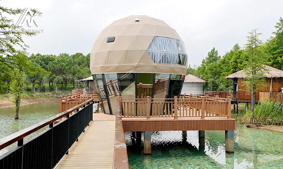 Two-story dome tent with a private lakeside deck and access walkway