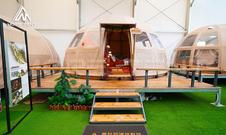 Custom dome glamping tent displayed on a modular platform
