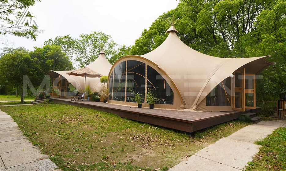 Custom glamping tent suites with panoramic windows and wood decks