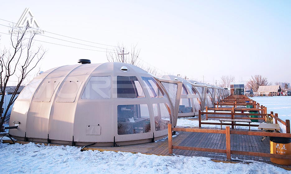 Insulated dome glamping tents operating in a snowy resort