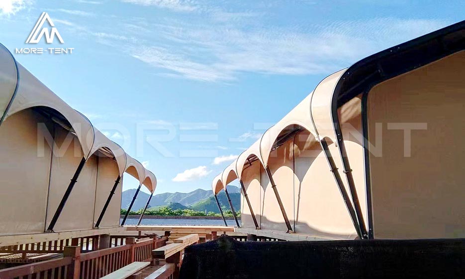 Close view of arched glamping tent structures on raised decks