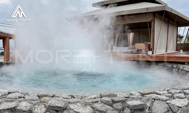 Pattaya tent terrace beside a steaming stone edged hot spring pool